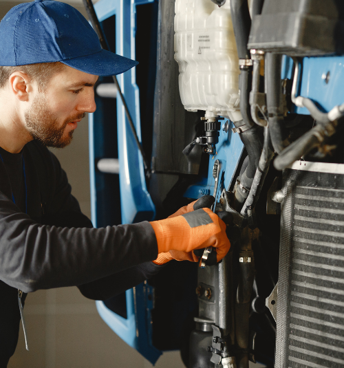 Technician repairing commercial ice machine in Dubai